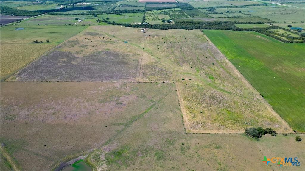 559 Bylerpool Road Kingsbury, TX 78638 - Photo 11 of 36 a view of a dry yard with wooden fence