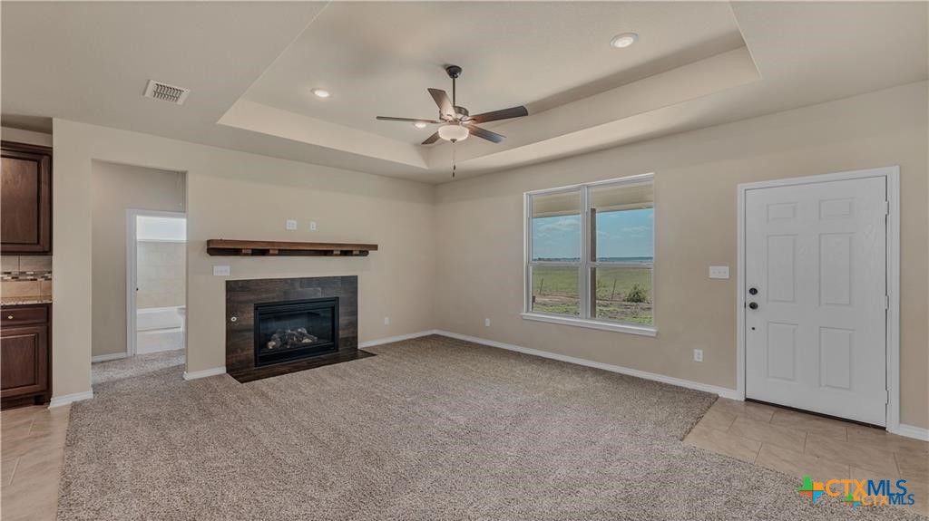 559 Bylerpool Road Kingsbury, TX 78638 - Photo 26 of 36 an empty room with windows and fireplace