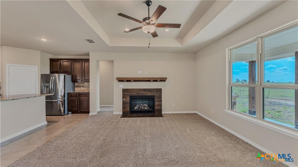 559 Bylerpool Road Kingsbury, TX 78638 - Photo 27 of 36 a living room with furniture and a fireplace