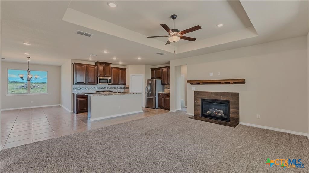 559 Bylerpool Road Kingsbury, TX 78638 - Photo 28 of 36 a view of a kitchen with a sink cabinets and a fireplace