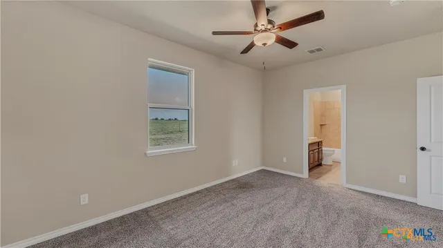 a bathroom with a granite countertop sink a mirror and a bathtub