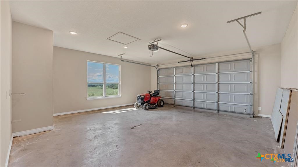 559 Bylerpool Road Kingsbury, TX 78638 - Photo 34 of 36 a view of a garage with furniture and a window