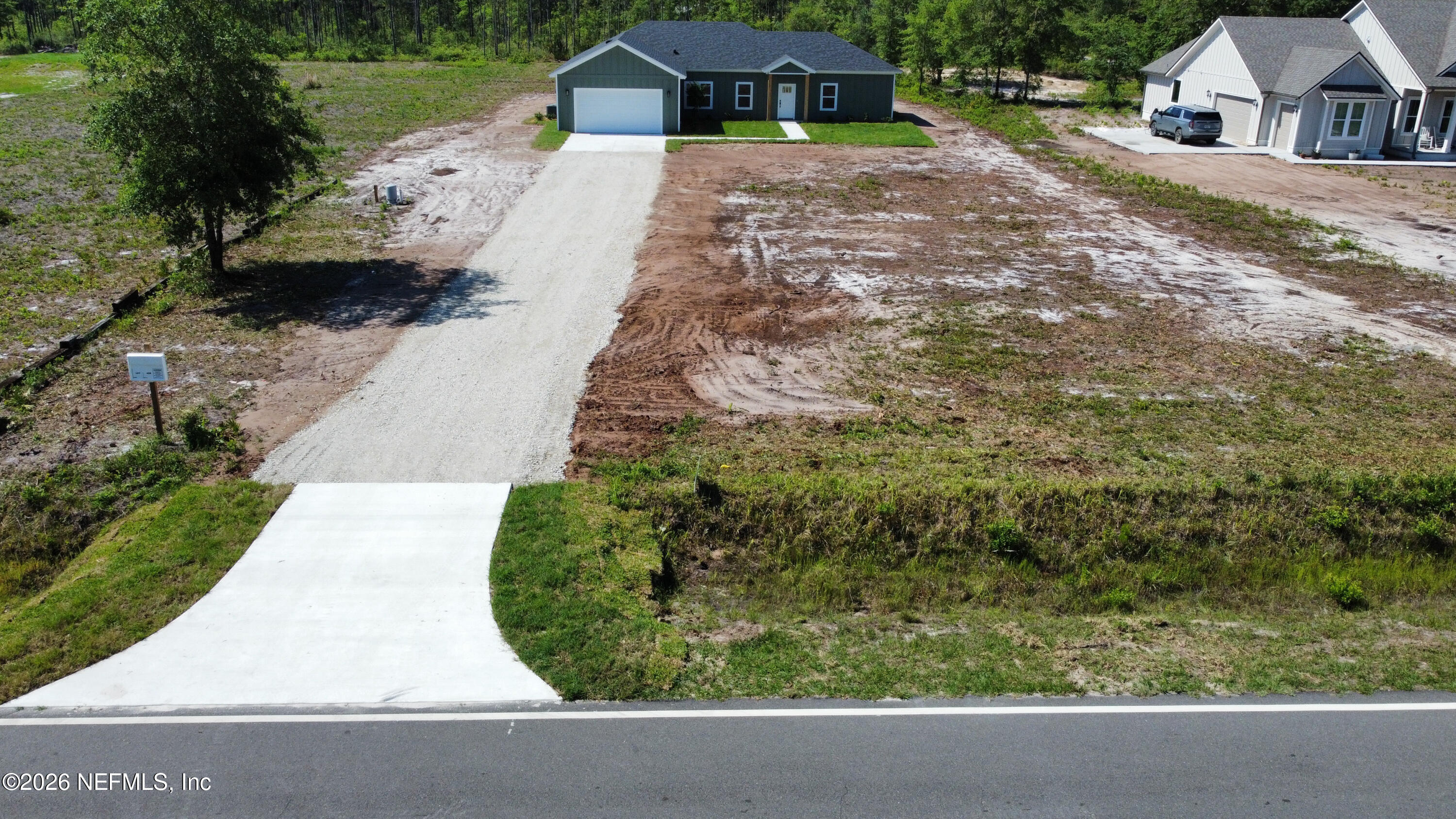 261121 Rowe Road Hilliard, FL 32046 - Photo 32 of 33 a view of house with yard
