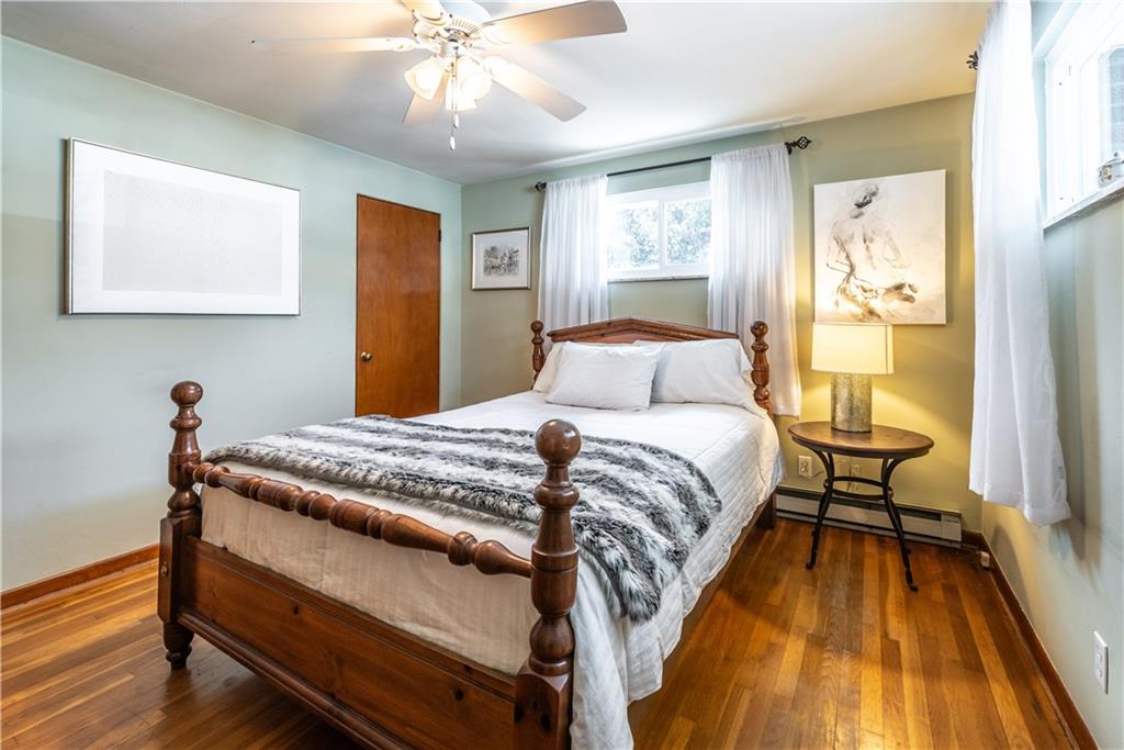 157 Seneca Drive Butler, PA 16001 - Photo 15 of 31 a bedroom with a bed and a chandelier