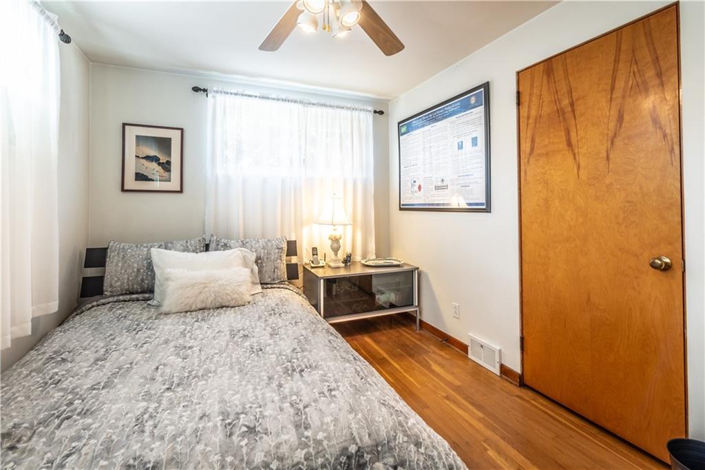 157 Seneca Drive Butler, PA 16001 - Photo 17 of 31 a bedroom with a bed and wooden floor
