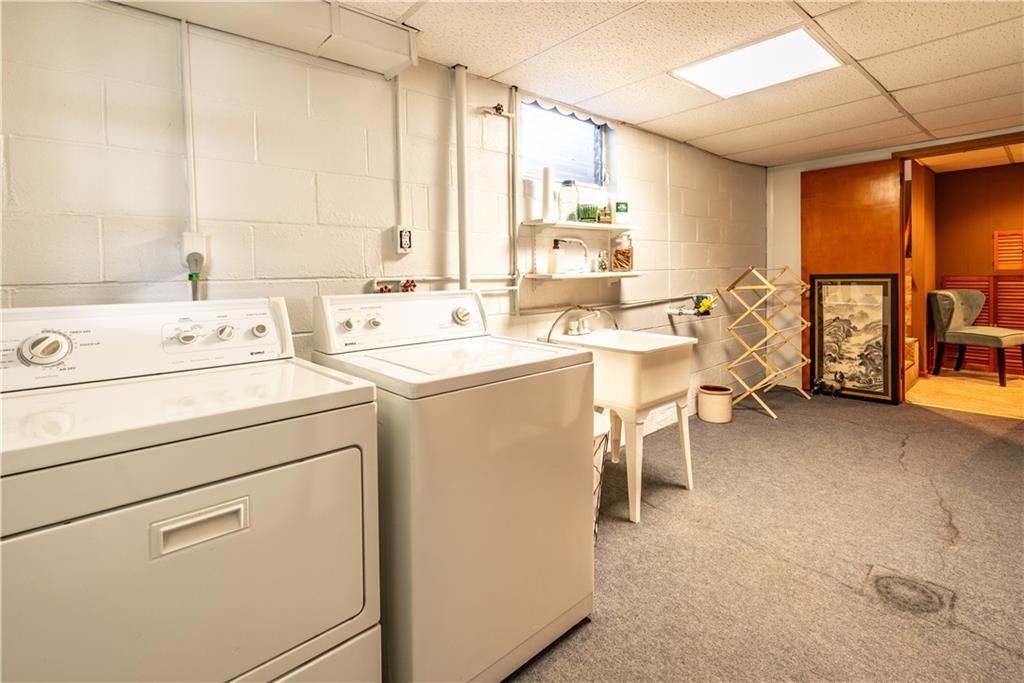 157 Seneca Drive Butler, PA 16001 - Photo 23 of 31 a view of washer and dryer with bathroom in the background