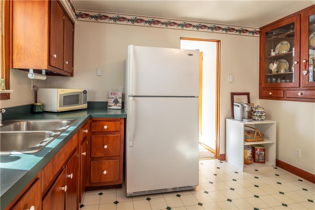 157 Seneca Drive Butler, PA 16001 - Photo 10 of 31 a kitchen with stainless steel appliances granite countertop a refrigerator and a stove top oven