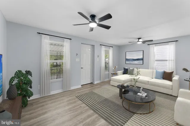 a kitchen with stainless steel appliances kitchen island granite countertop a sink stove and microwave