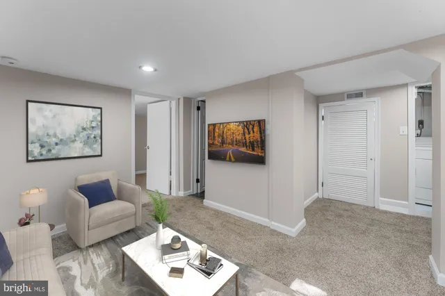 a kitchen with a refrigerator and a stove top oven