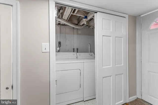 a kitchen with refrigerator a sink and a stove