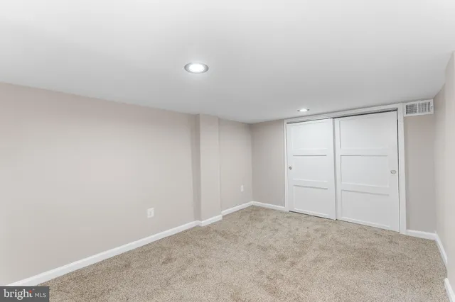 an empty room with a bathroom