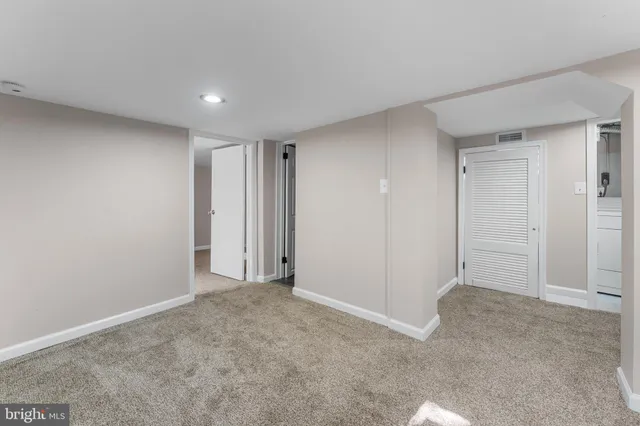 a white toilet sitting next to a bathroom sink