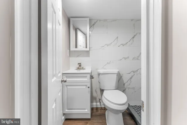 a view of a brick house with large windows