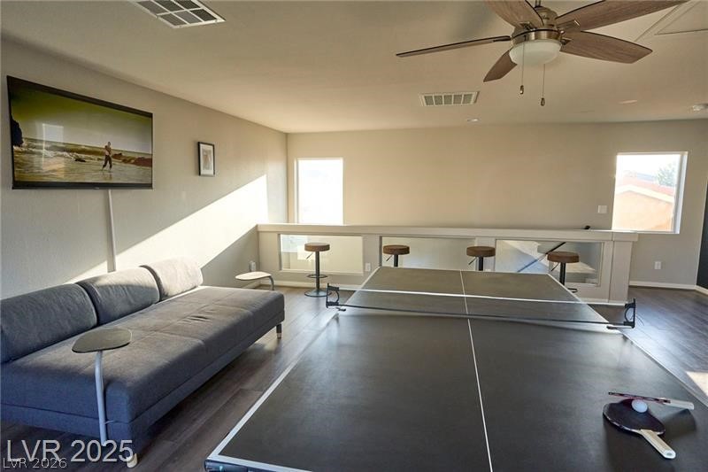 6302 Jackson Spring Road Las Vegas, NV 89118 - Photo 18 of 23 A dynamic loft space features sleek wood flooring and a game area for leisure.