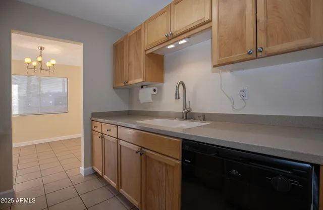 a view of a patio with a table and chairs