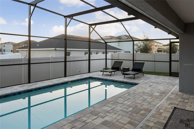 a wooden bench sitting in front of a building