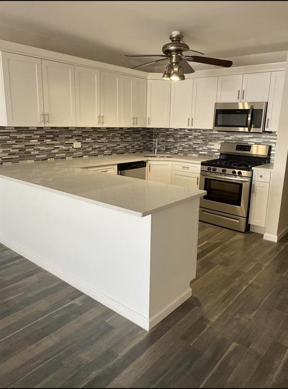 7000 Boulevard East, Unit 29I Guttenberg, NJ 07093 - Photo 3 of 16 a kitchen with kitchen island granite countertop a sink cabinets and stainless steel appliances