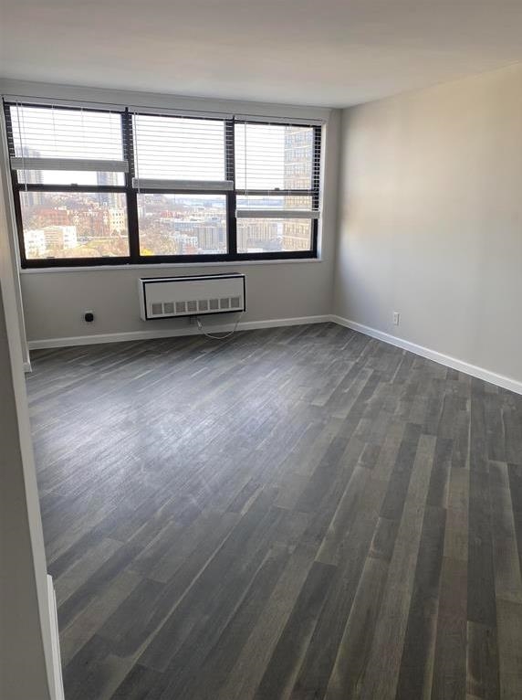 7000 Boulevard East, Unit 29I Guttenberg, NJ 07093 - Photo 7 of 16 wooden floor and window in an empty room