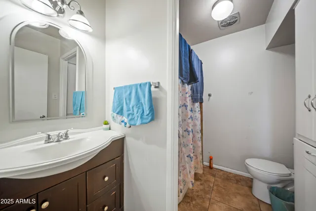 a bed room with a bed and a television