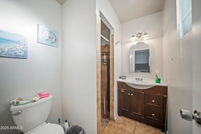 a bedroom with a bed and a table in it