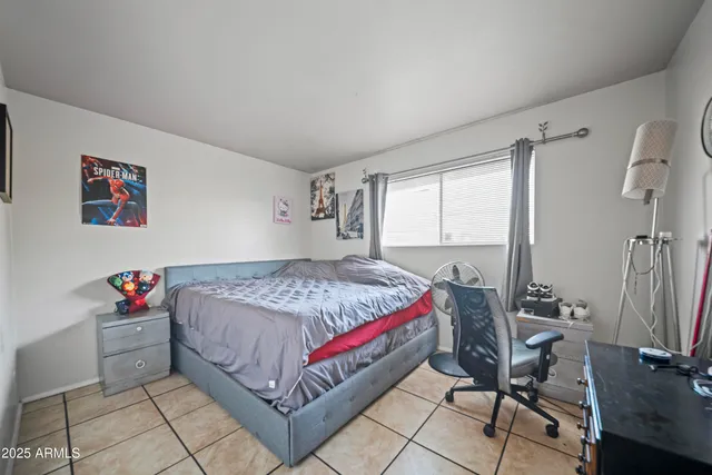 a living room with furniture a chandelier a mirror and a window