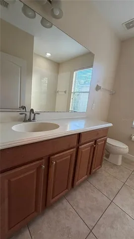 a room with a wooden cabinets and washing machine