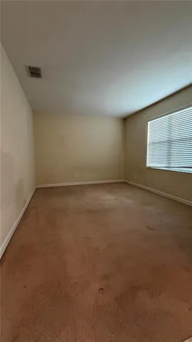 a view of a livingroom with a staircase