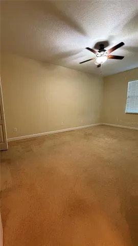 a spacious bathroom with a toilet a sink and bathtub
