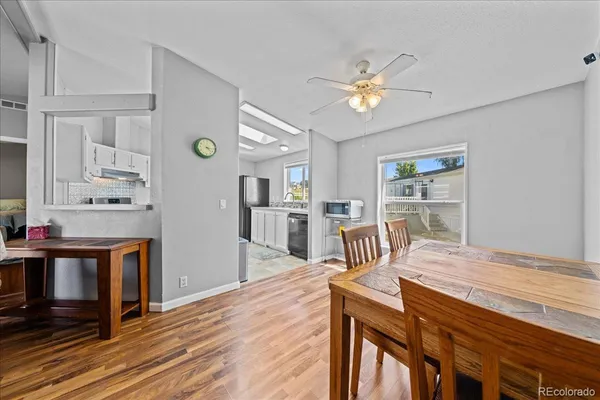 a view of a dining room with furniture and wooden floor