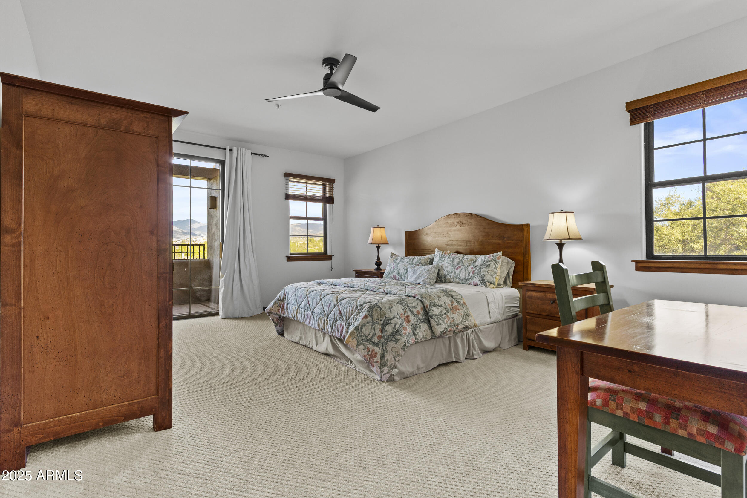 36601 North Mule Train Road, Unit D18 Carefree, AZ 85377 - Photo 16 of 53 a bedroom with a large bed and a window