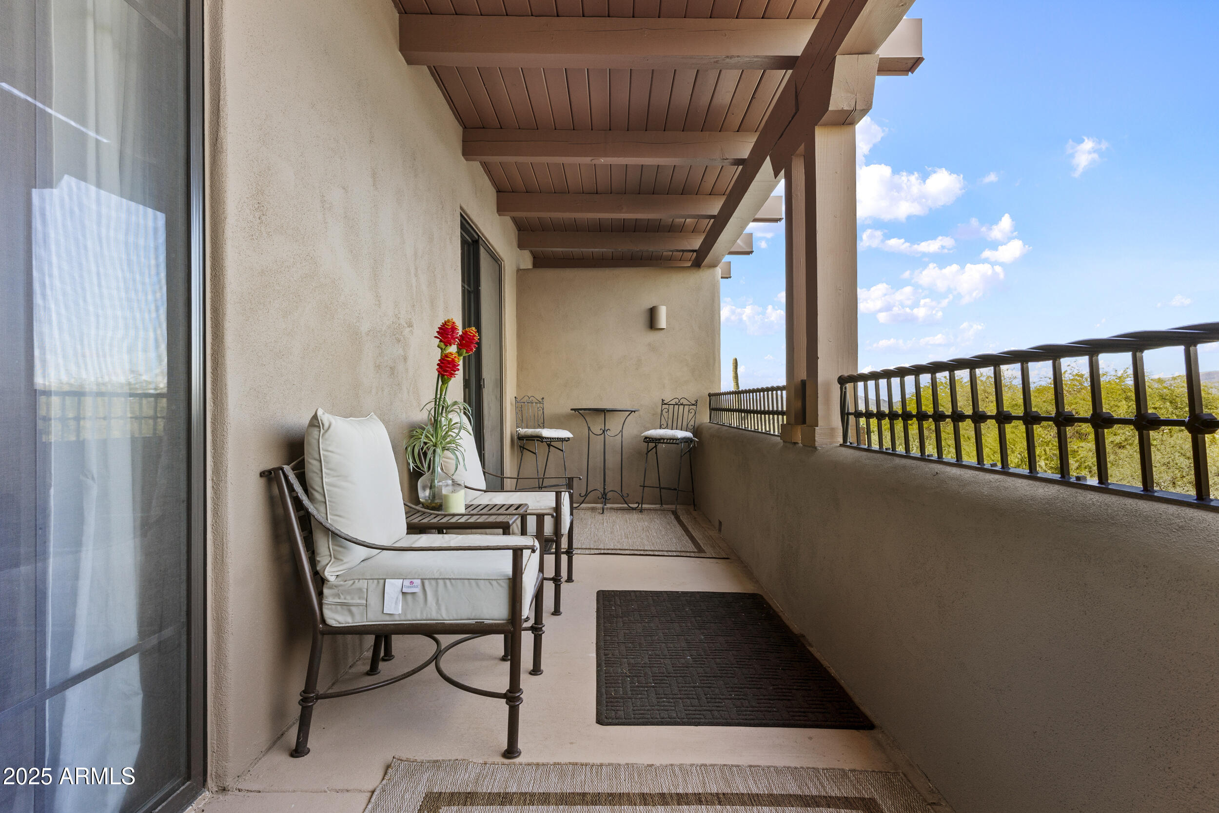36601 North Mule Train Road, Unit D18 Carefree, AZ 85377 - Photo 17 of 53 a dining room with furniture and a floor to ceiling window
