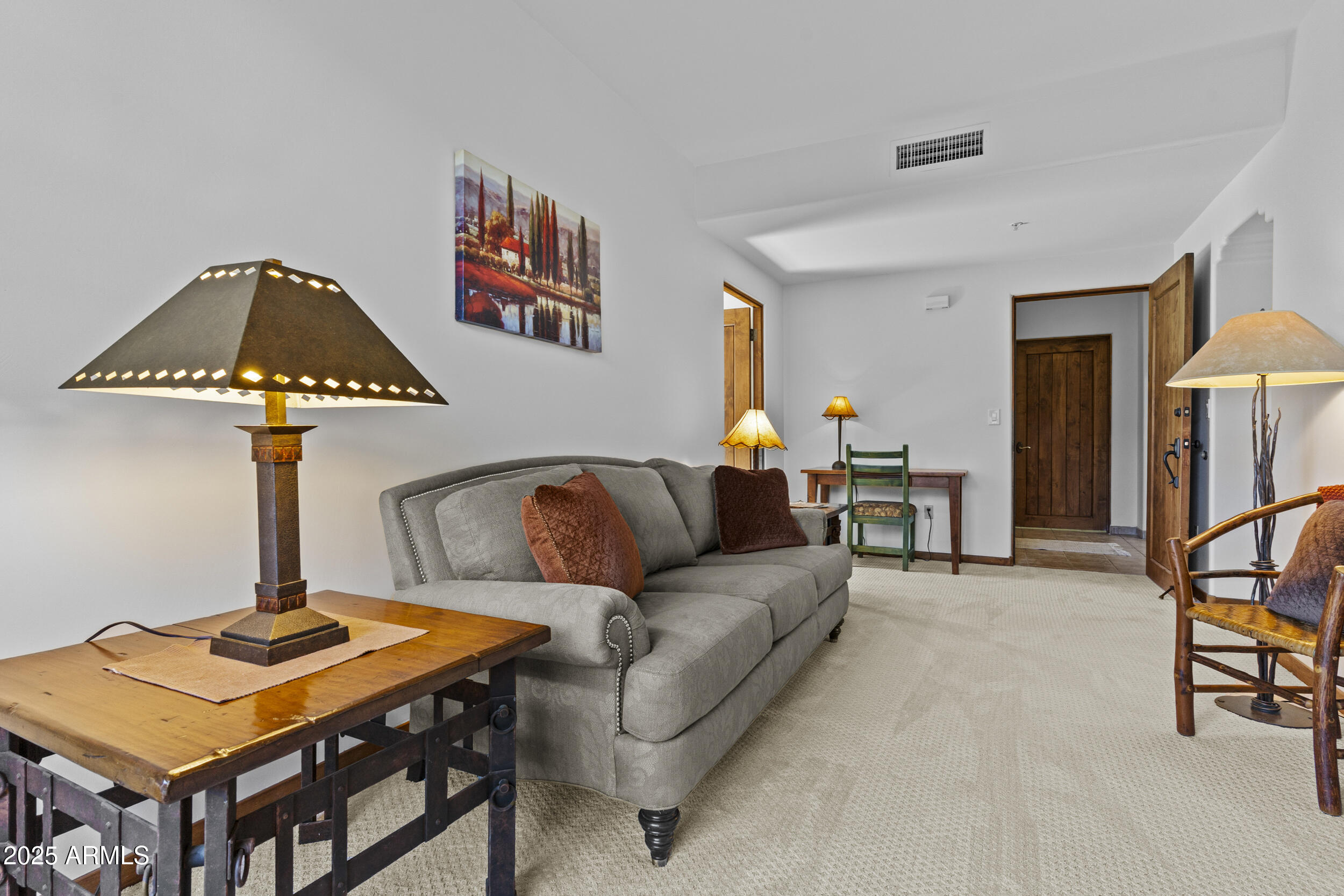 36601 North Mule Train Road, Unit D18 Carefree, AZ 85377 - Photo 29 of 53 a living room with furniture and a table