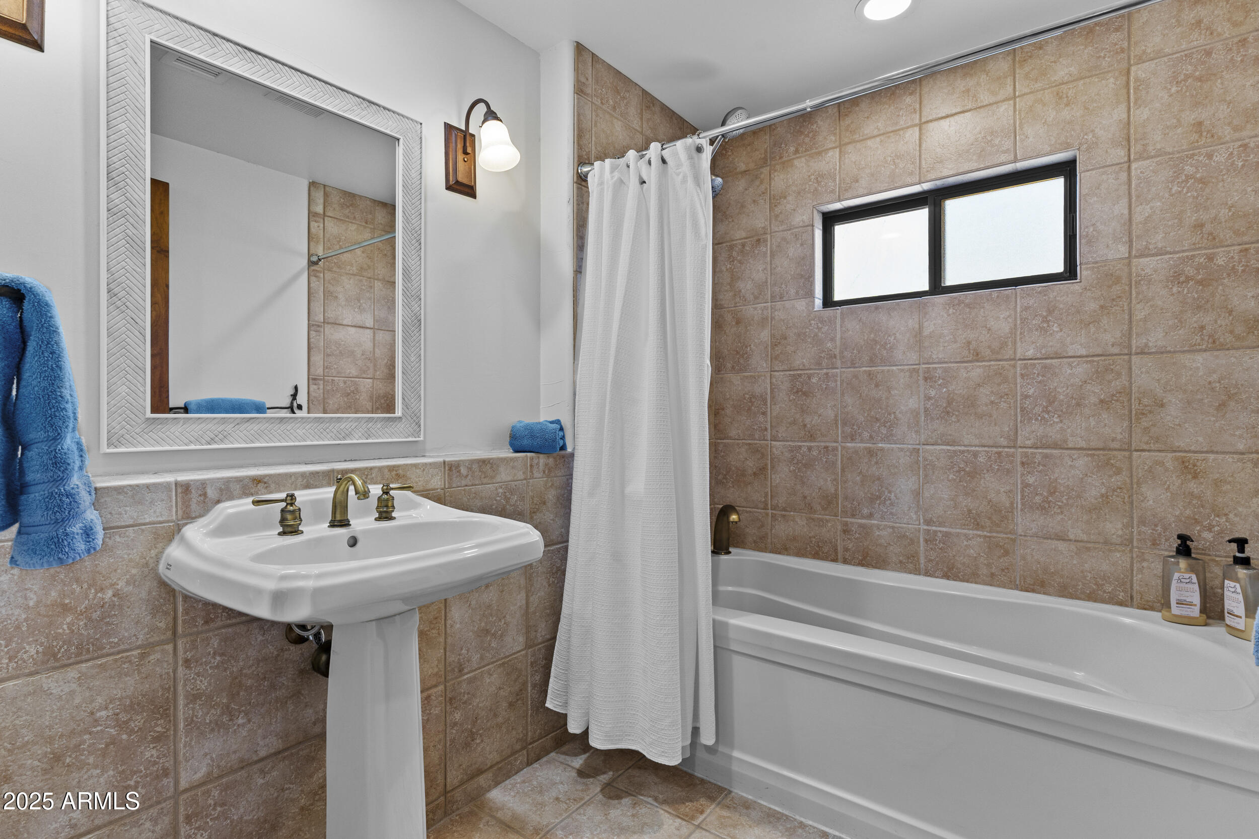 36601 North Mule Train Road, Unit D18 Carefree, AZ 85377 - Photo 36 of 53 a bathroom with a sink and a mirror
