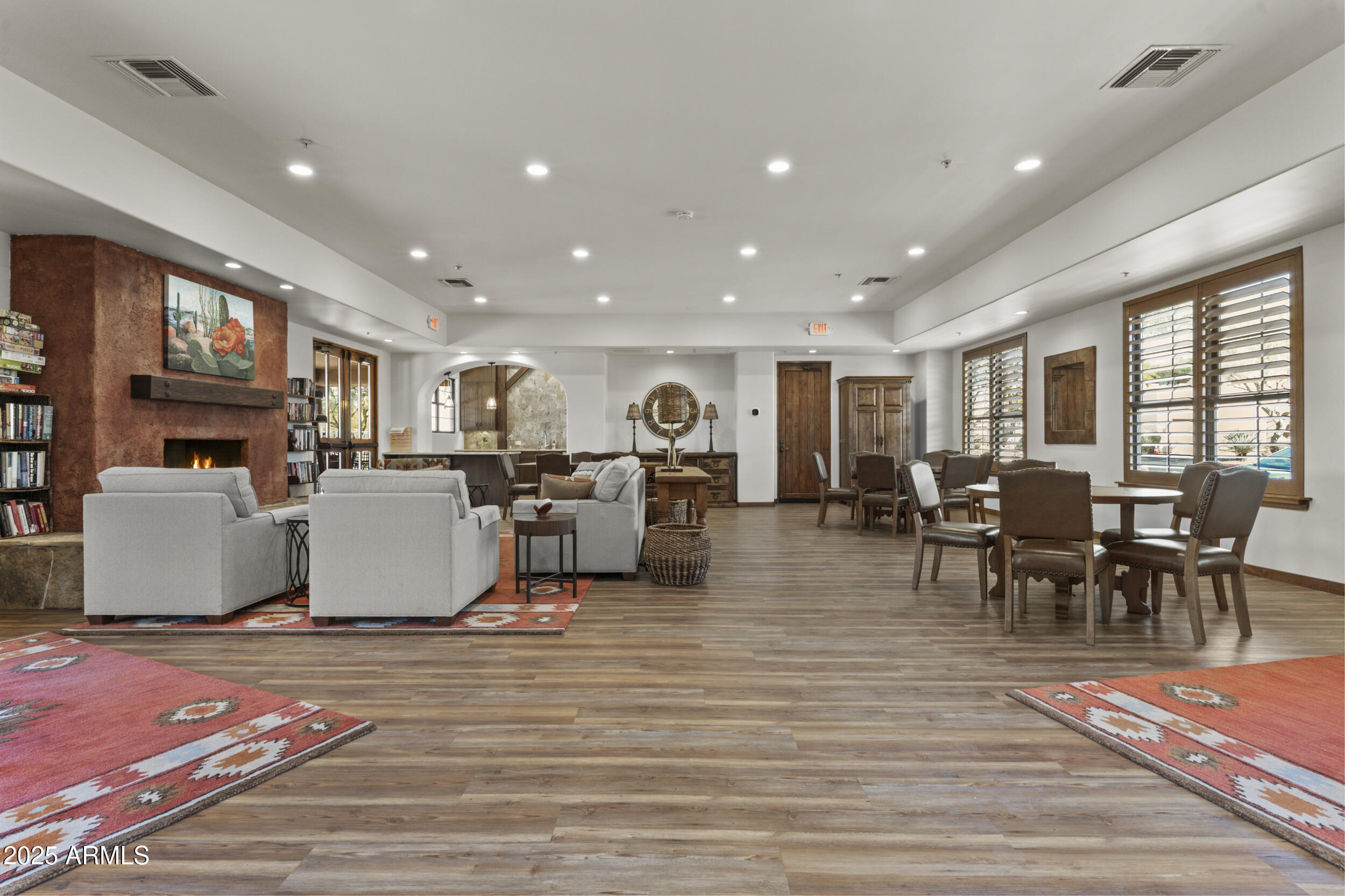 36601 North Mule Train Road, Unit D18 Carefree, AZ 85377 - Photo 50 of 53 a living room with fireplace furniture and a dining table