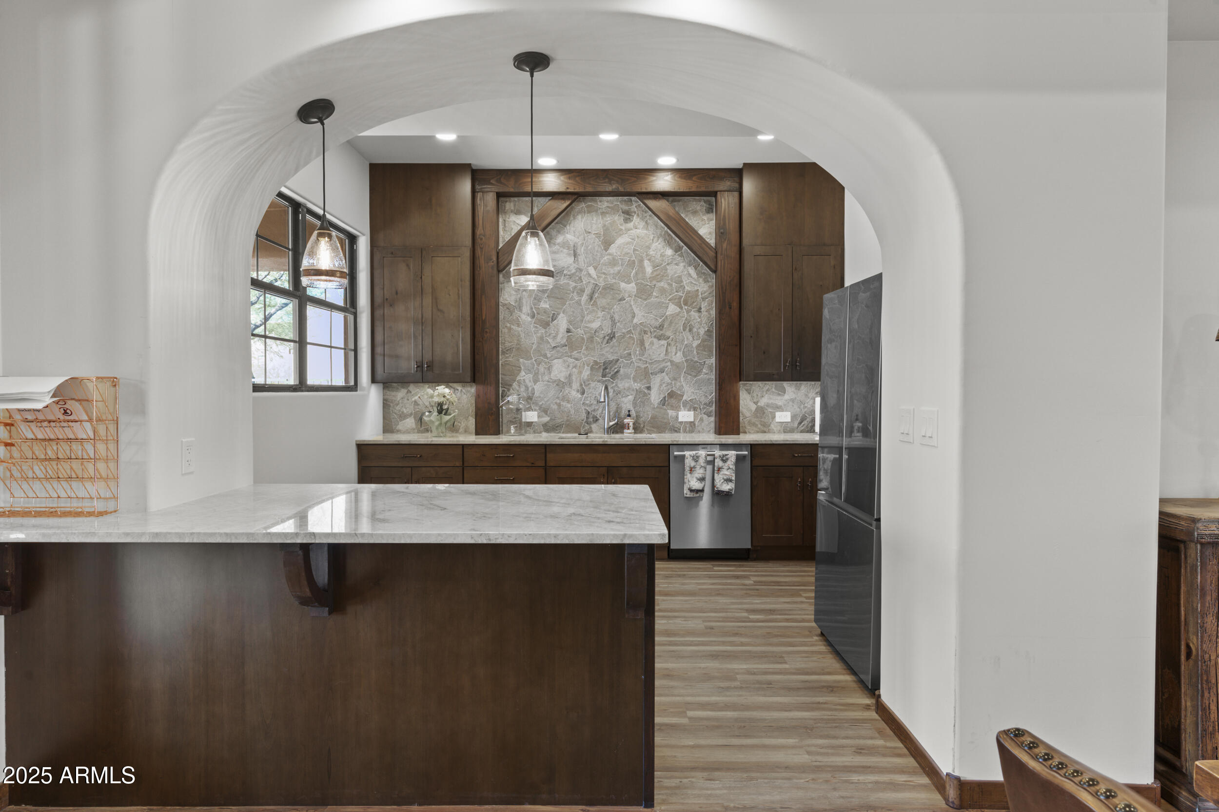 36601 North Mule Train Road, Unit D18 Carefree, AZ 85377 - Photo 51 of 53 a view of a hallway with wooden floor and entryway