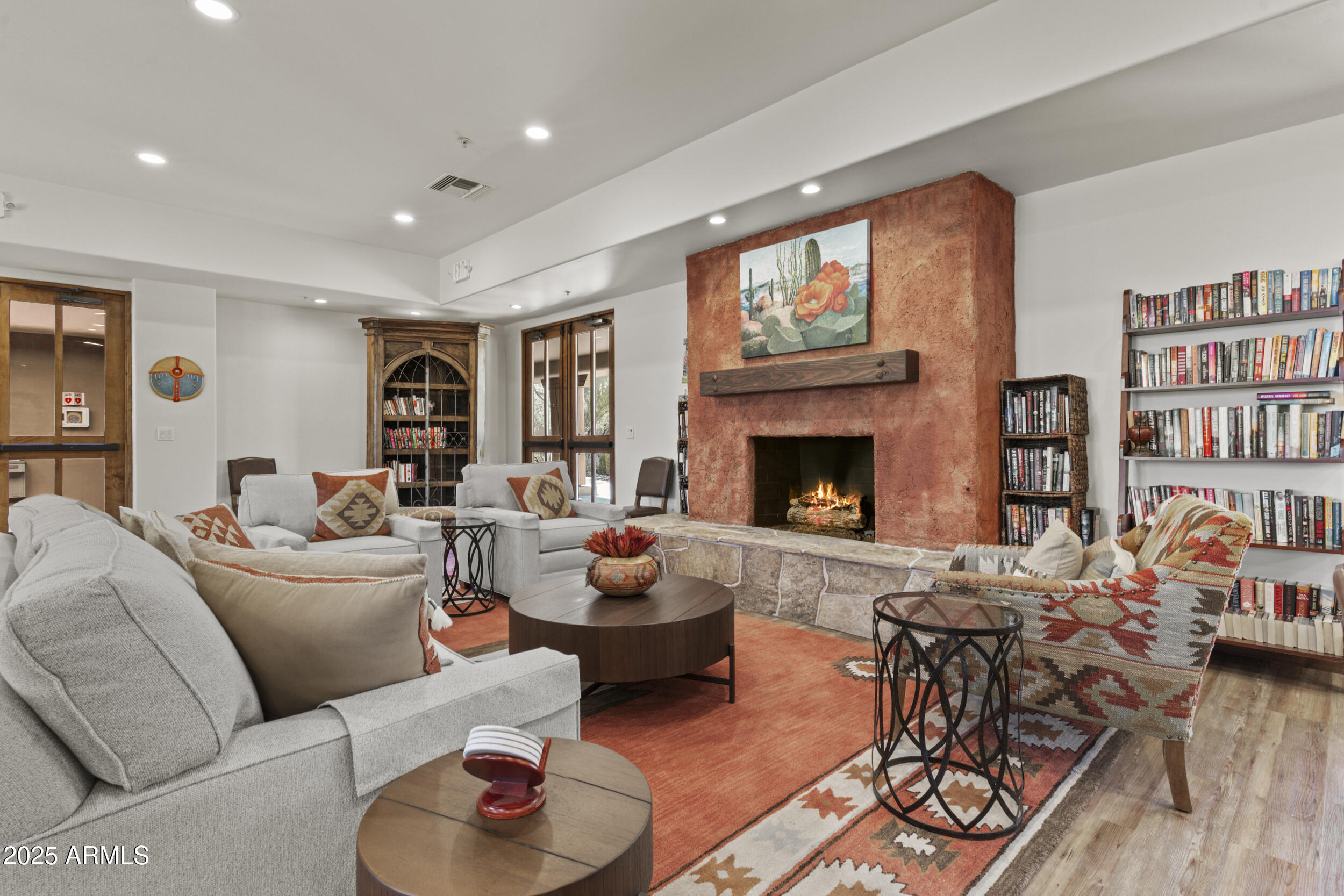 36601 North Mule Train Road, Unit D18 Carefree, AZ 85377 - Photo 52 of 53 a living room with furniture and a fireplace