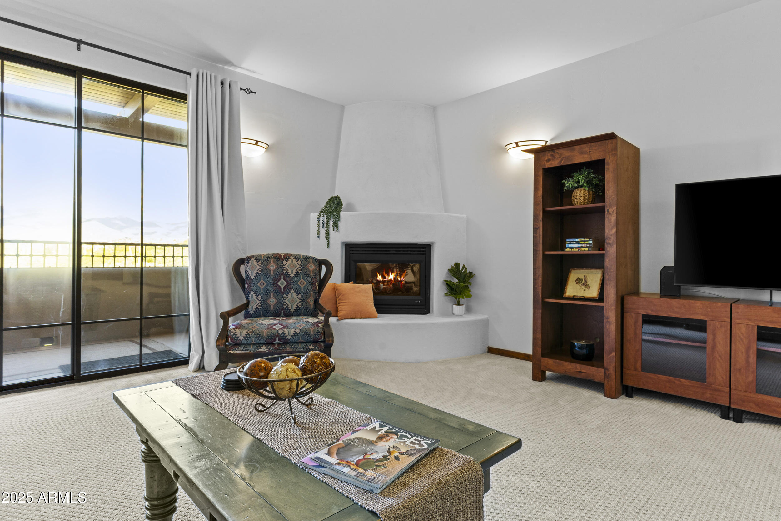 36601 North Mule Train Road, Unit D18 Carefree, AZ 85377 - Photo 9 of 53 a living room with furniture and a flat screen tv