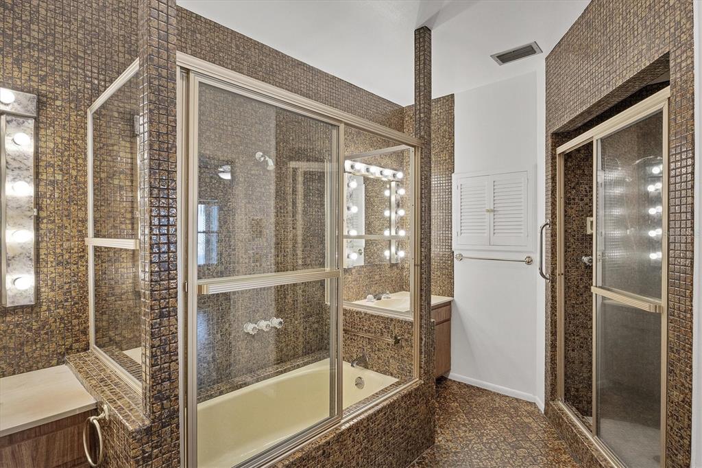 2605 Desoto Road Sarasota, FL 34234 - Photo 38 of 57 a bathroom with a glass shower door
