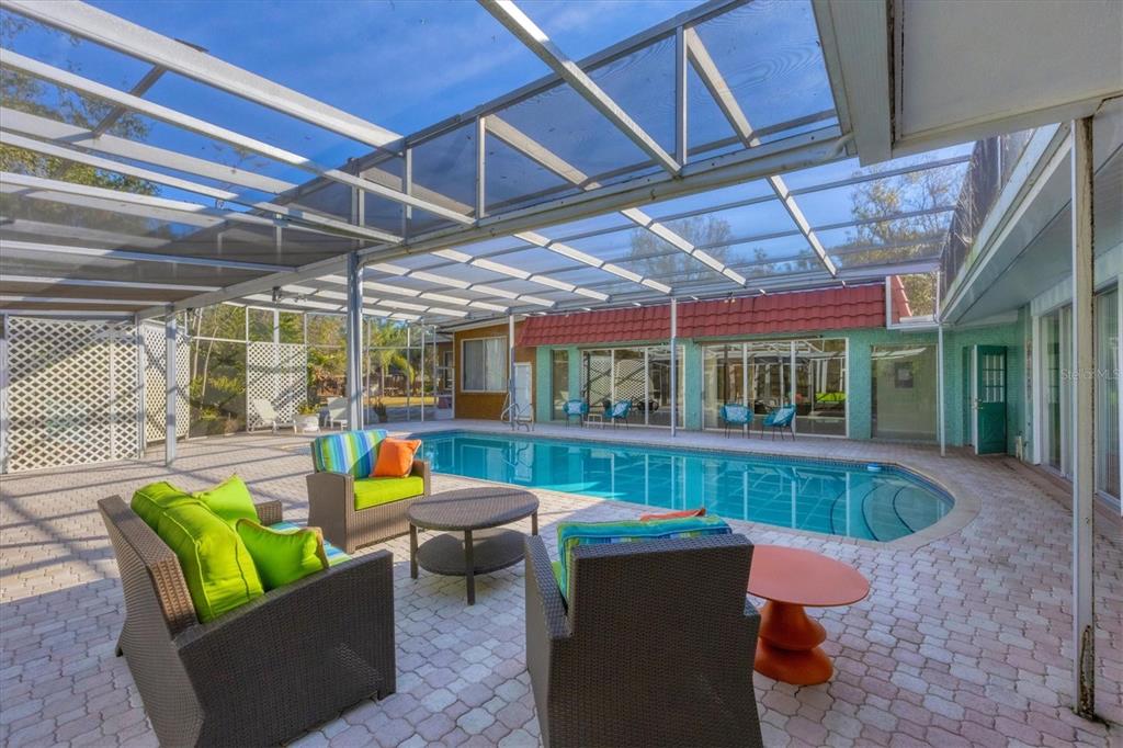 2605 Desoto Road Sarasota, FL 34234 - Photo 52 of 57 a view of a patio with couches chairs and a table