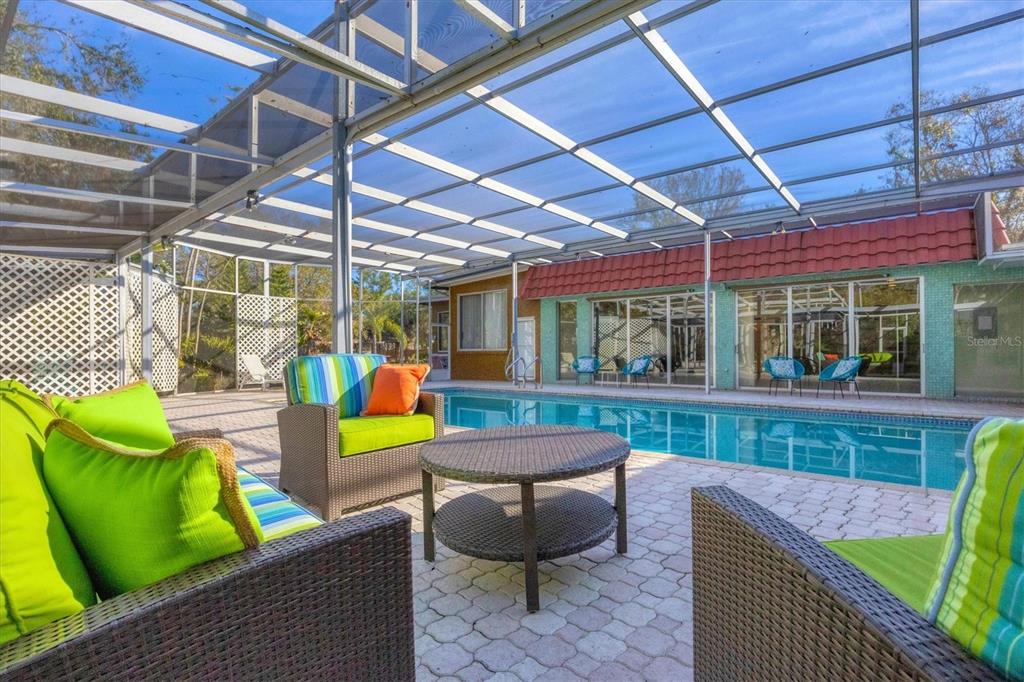 2605 Desoto Road Sarasota, FL 34234 - Photo 53 of 57 a view of a chairs and table in patio with wooden fence