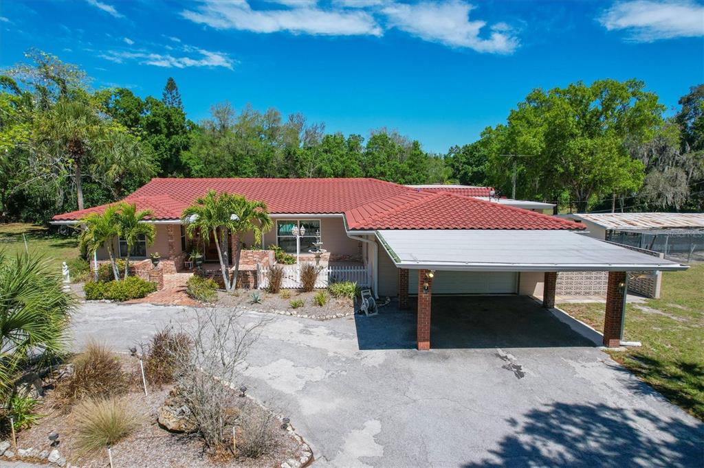 2605 Desoto Road Sarasota, FL 34234 - Photo 6 of 57 an outdoor space with furniture and umbrella