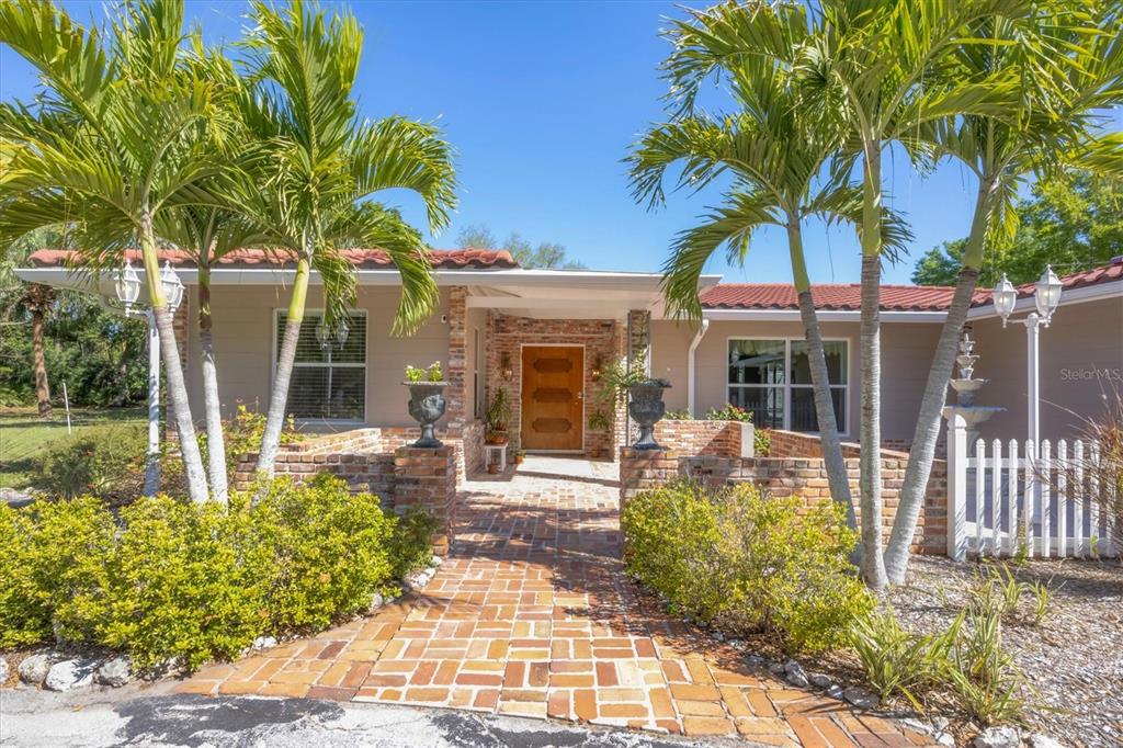2605 Desoto Road Sarasota, FL 34234 - Photo 7 of 57 a front view of a house with garden