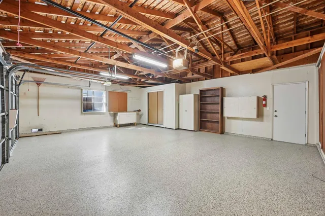 a view of empty room with white walls