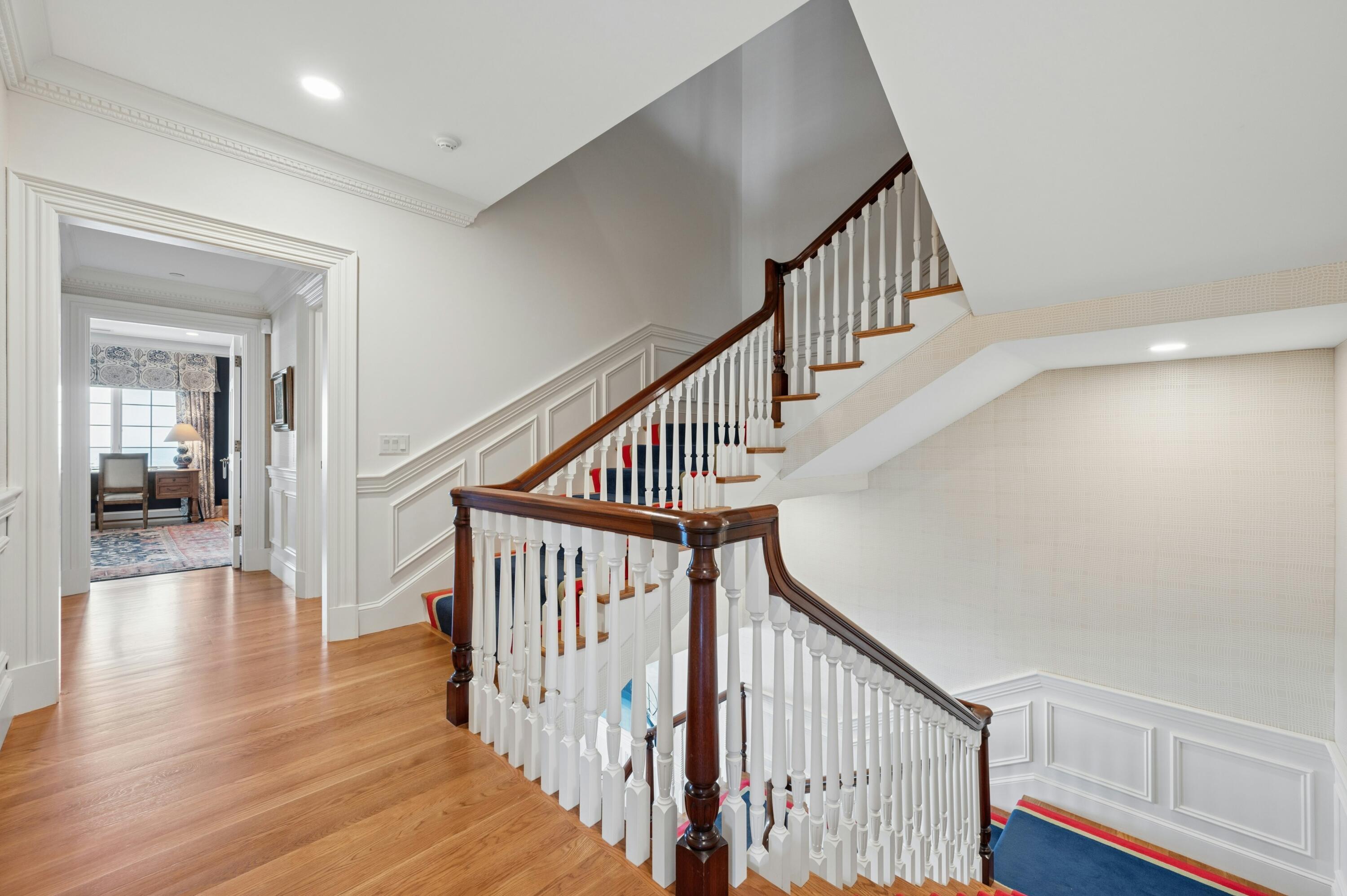 23 Snow Inn Road, Unit 7 Harwich Port, MA 02646 - Photo 26 of 37 a view of staircase with wooden floor and white walls