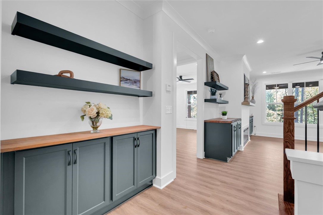 407 Blue Ridge Court Westminster, SC 29693 - Photo 5 of 48 This inviting interior features elegant built-in shelving and warm wood flooring.