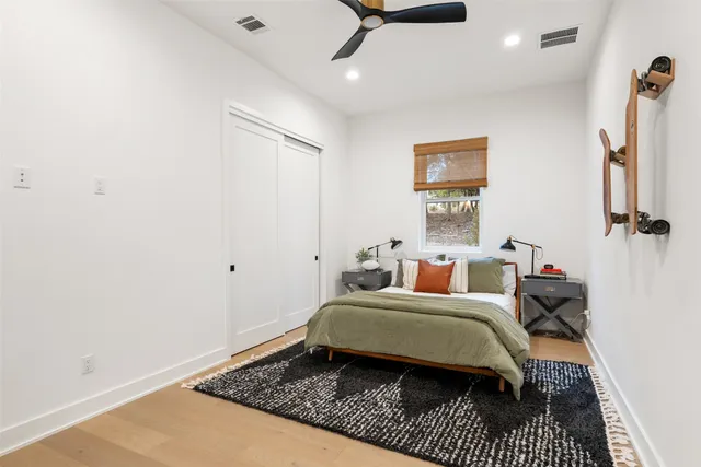 a view of a backyard with table and chairs under an umbrella