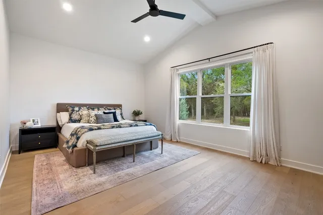 a bedroom with a bed and window