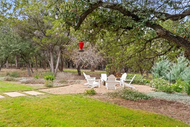 a view of a patio with swimming pool table and chairs