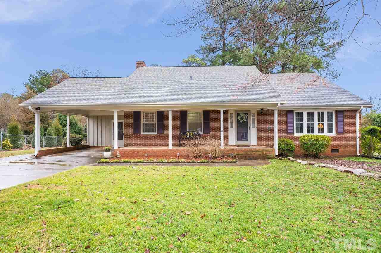 709 Merwin Road Raleigh, NC 27606 - Photo 1 of 30 a front view of a house with a yard and porch