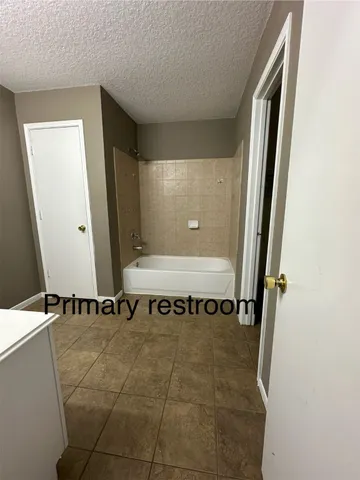 a bathroom with a sink a mirror and a shower